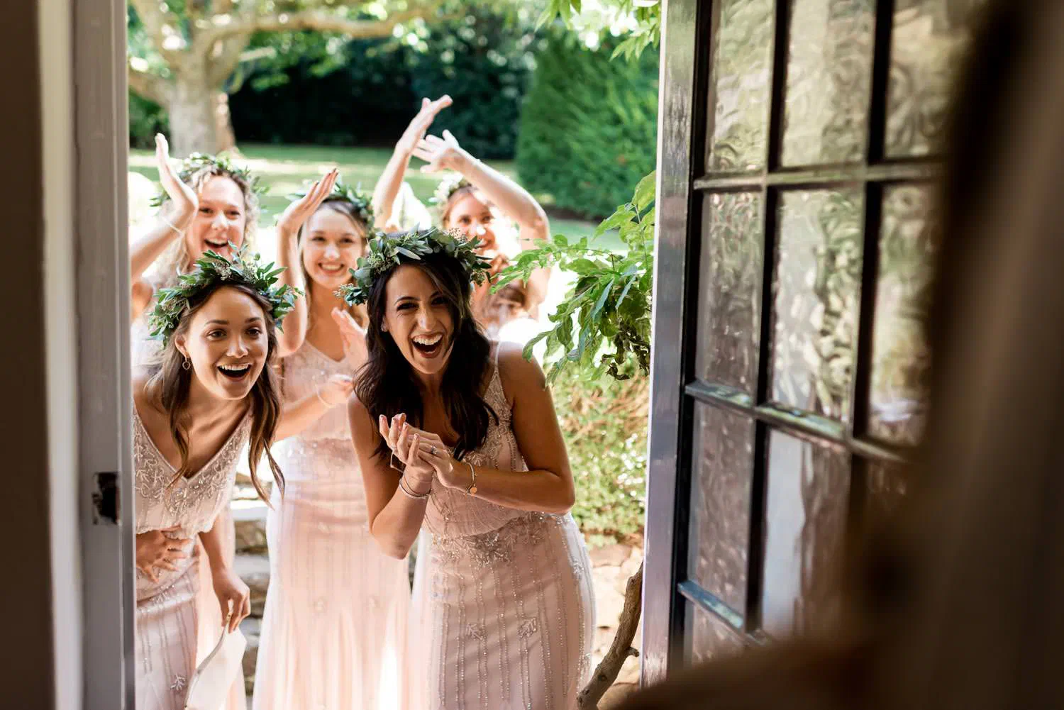 Bridesmaids laughing at a wedding