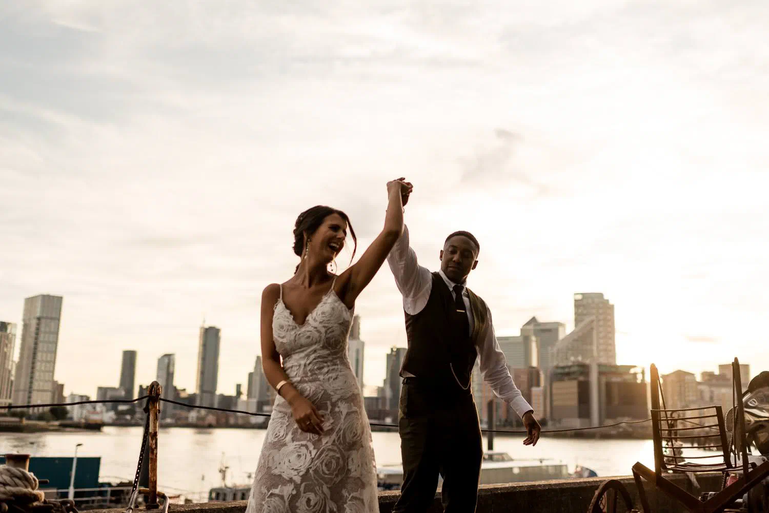 Couple dancing at golden hour by the Thames